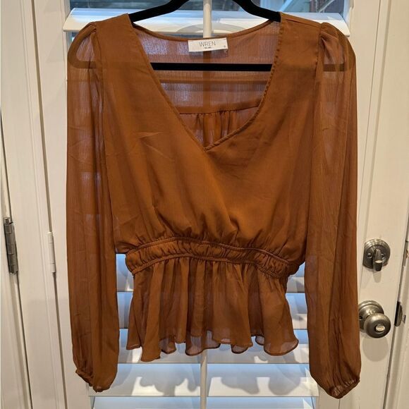 Wren Tops - Very flattering long sleeve peplum sheer blouse.